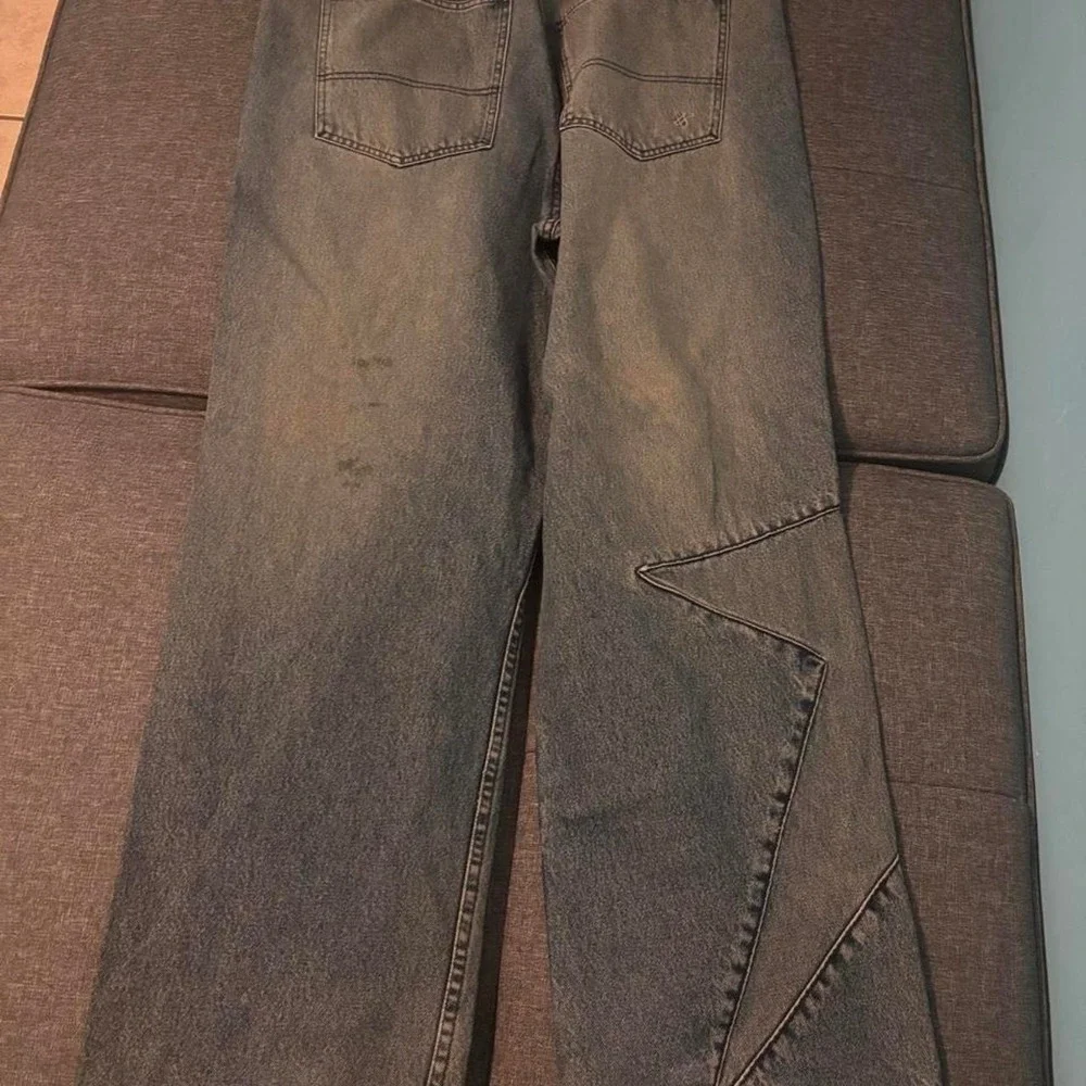 Baggy blue Sean John jeans with a distressed look Size 38x32